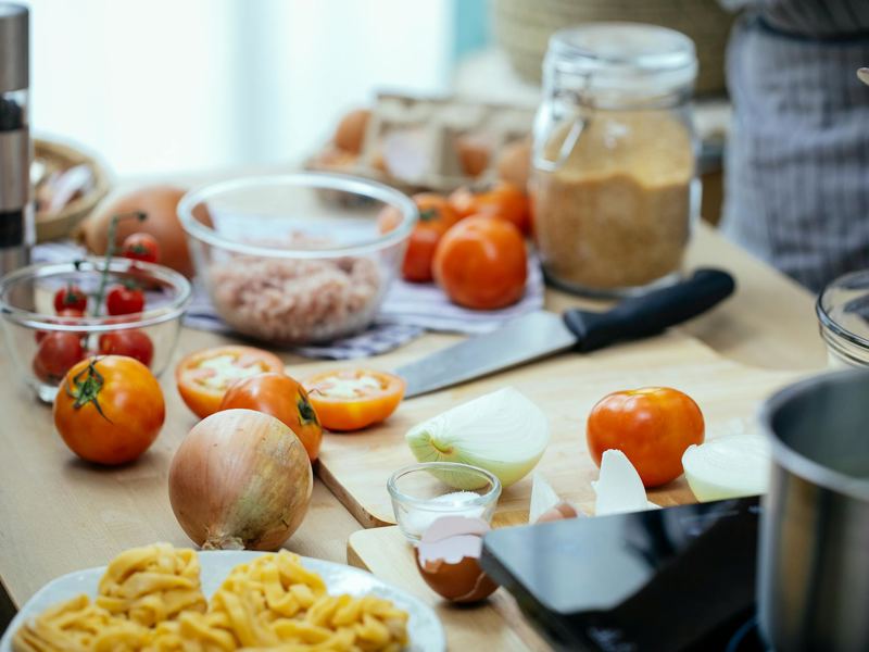 fresh ingredients like tomatoes and onions for preparing an italian me image